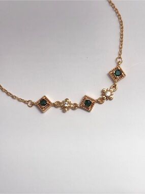 Delicate Gold-Plated Bracelet with Green and Clear Stones